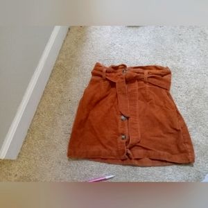 An orangidh-tan corduroy skirt